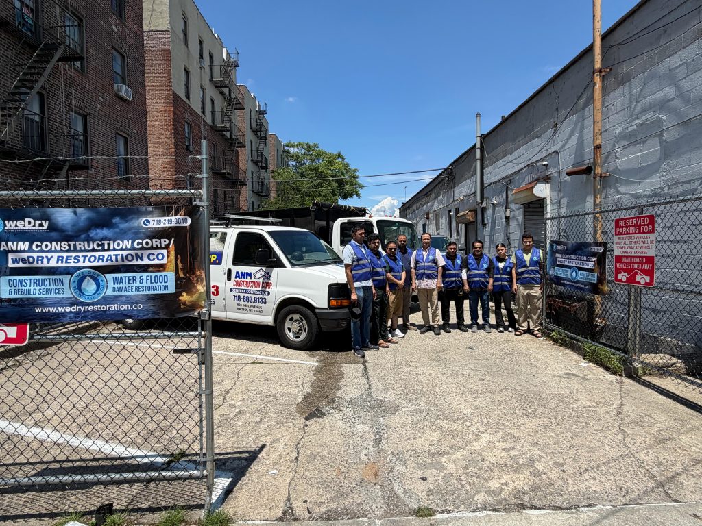 WeDry Restoration and ANM Construction Corp team and truck fleet